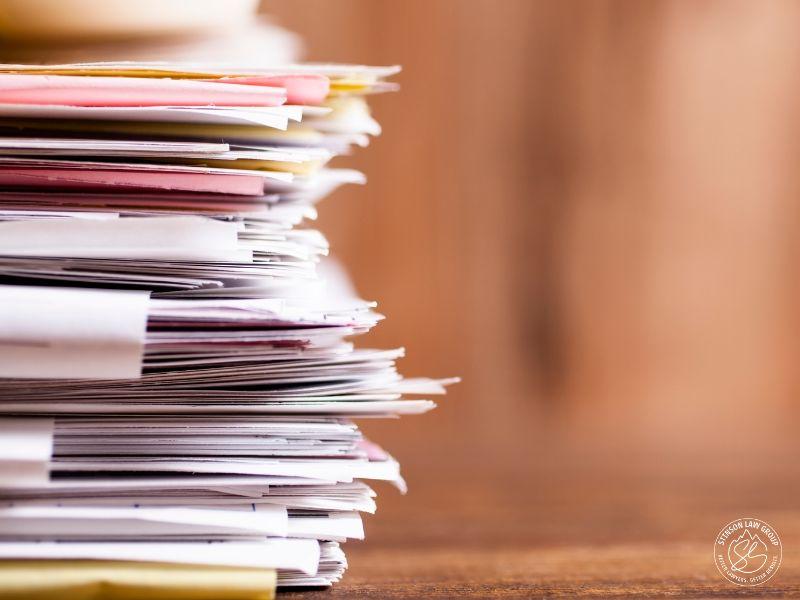 Stack of insurance claim documentation and records