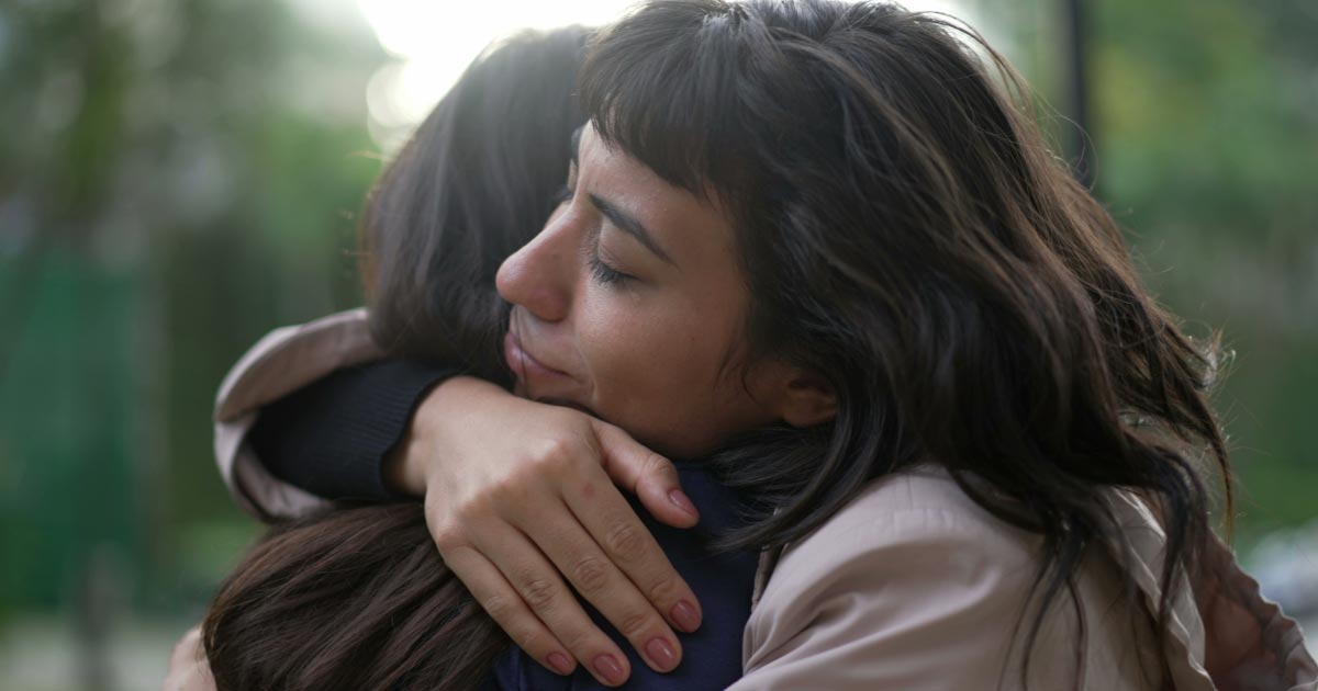 Family members hugging one another